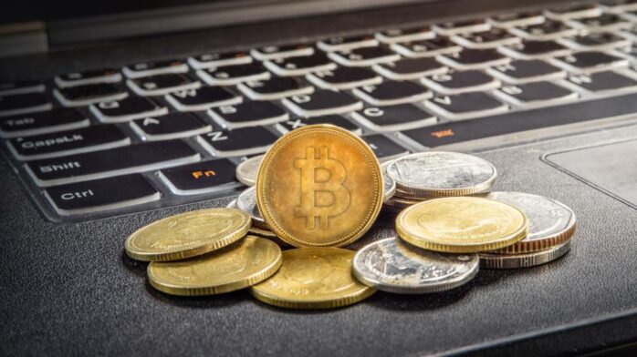 https  specials images.forbesimg.com imageserve 6092f22514a9b91e010ba3d0 bitcoin and laptop 960x0 1.jpg fitscale 1 - How Is Cryptocurrency Recorded In Accounting